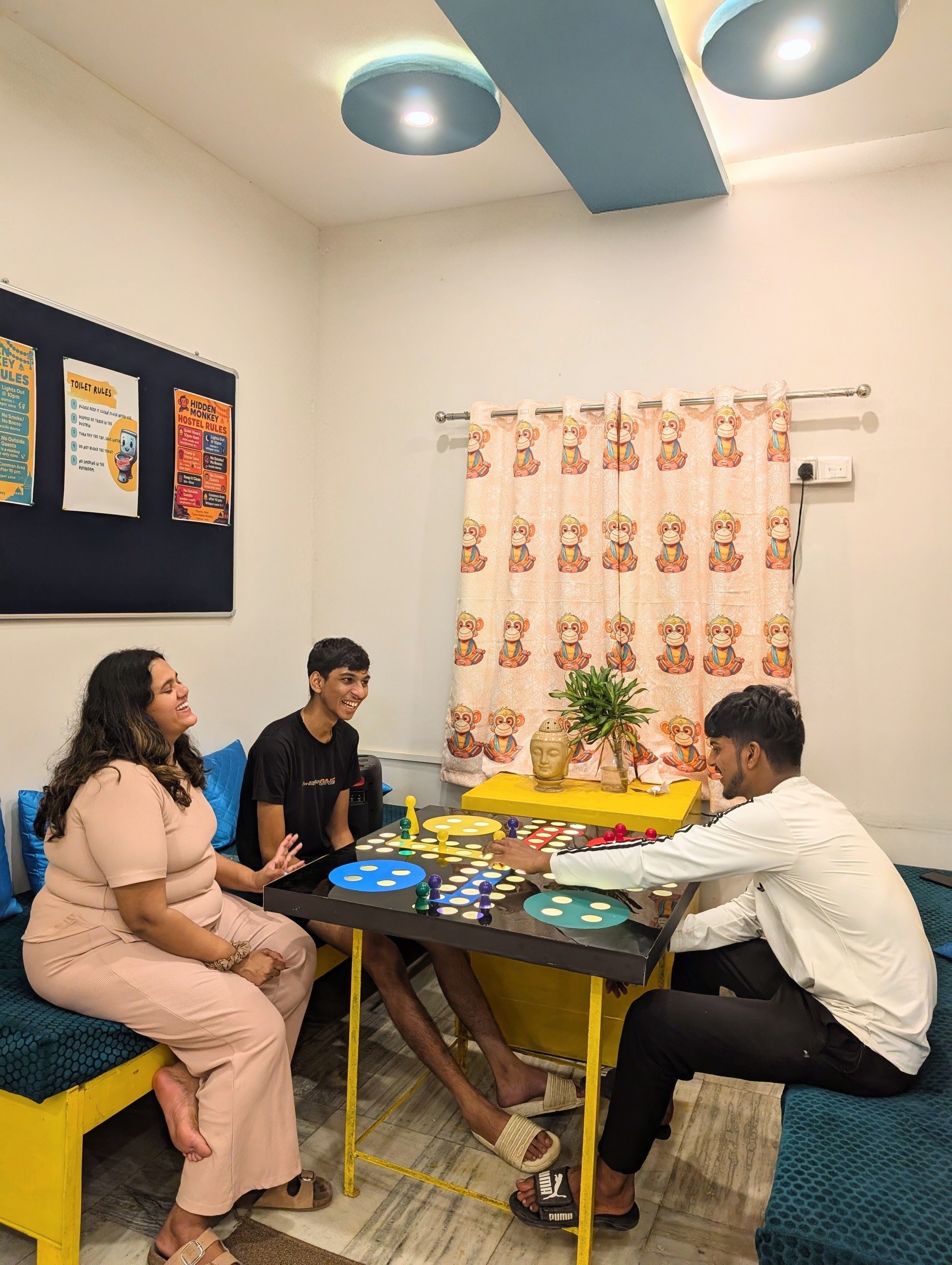 Guests playing Ludo in the common room