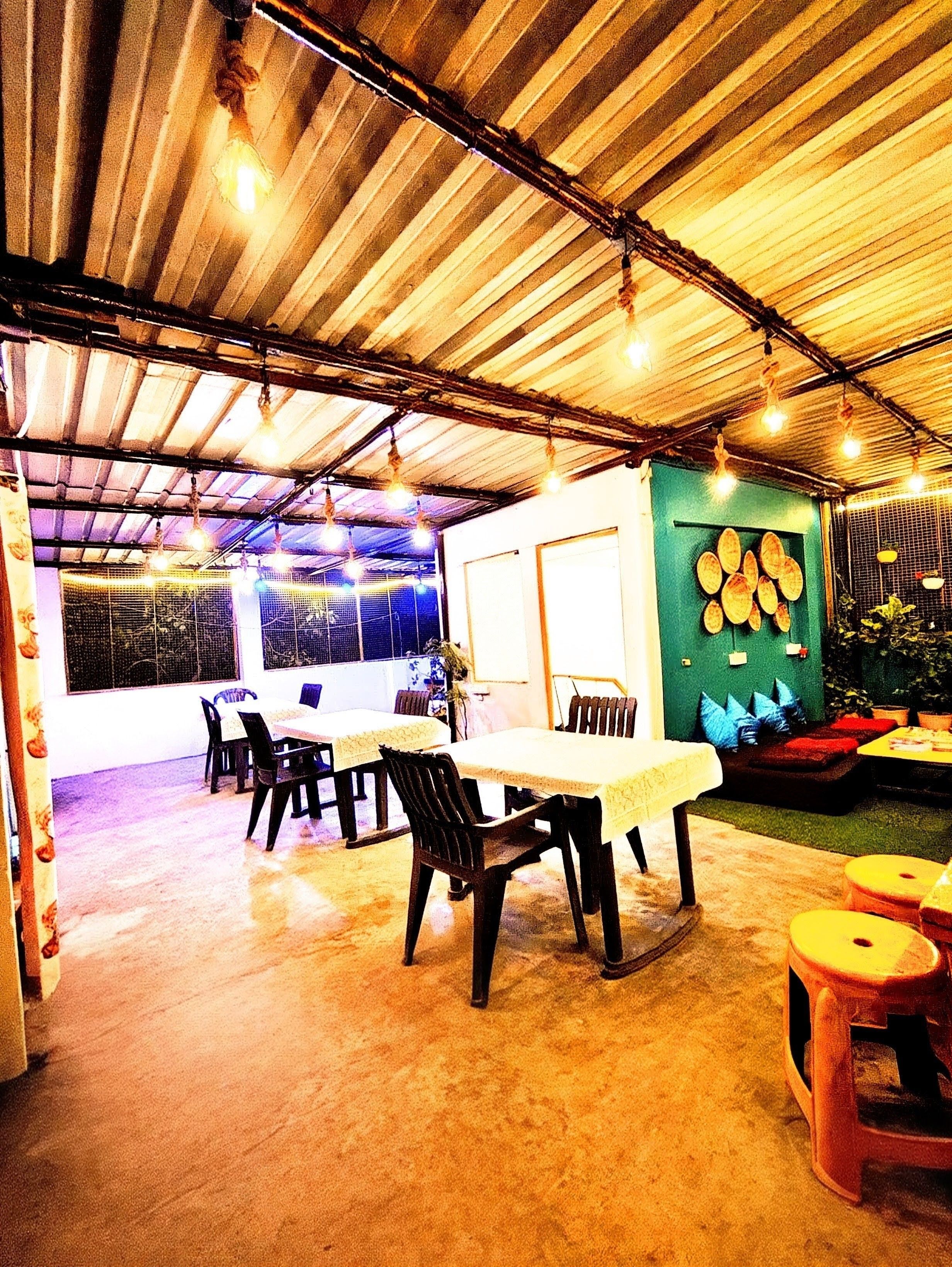 Rooftop dining area with ambient lights