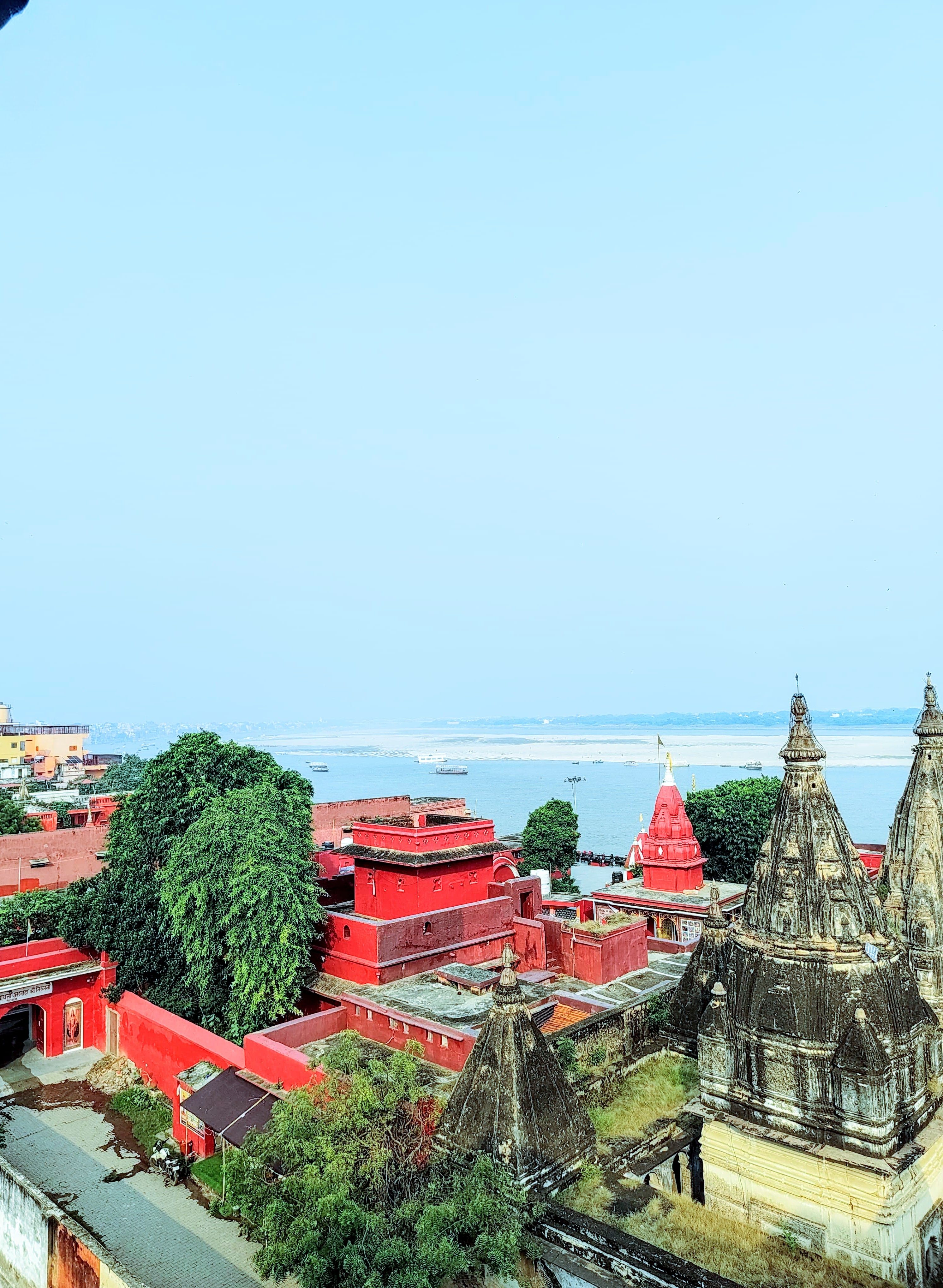Temple spires and the Ganges viewed from the terrace — Varanasi
